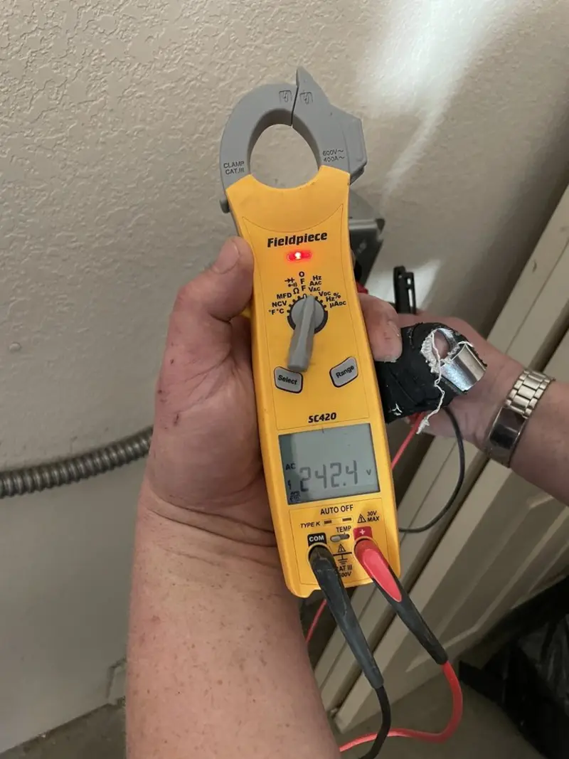 Voltage testing with clamp meter during Outlet Installation in Escanaba